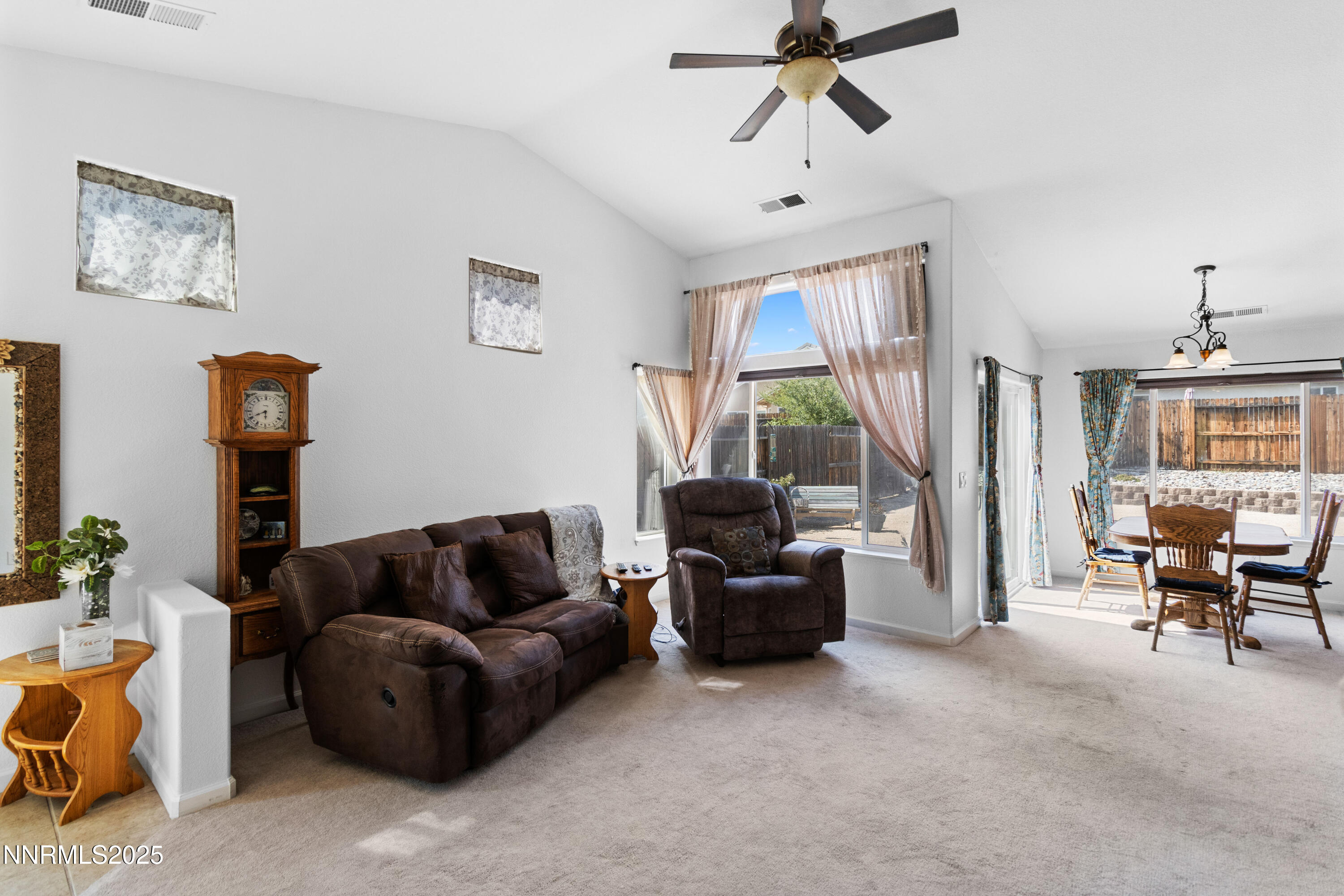 10375 Rosemount Drive Reno, NV 89521 - Photo 10 of 29 a living room with furniture a ceiling fan and a window