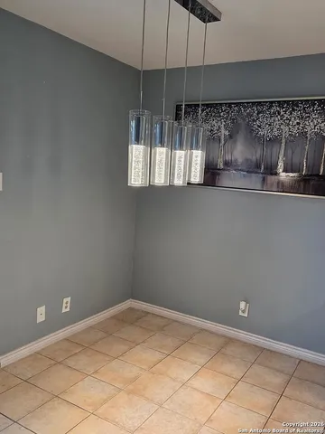 a kitchen with a stove and a refrigerator
