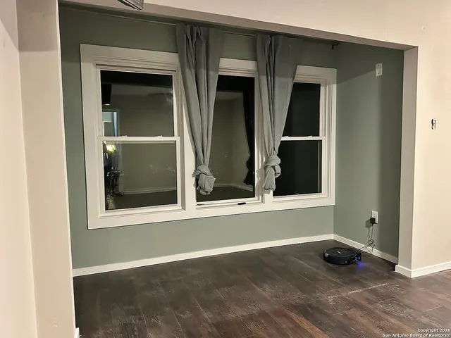 a view of a house that has a large window