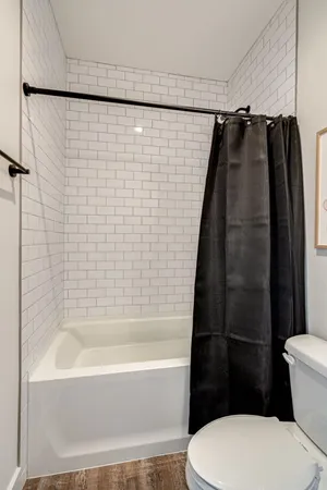 a bathroom with a shower and a toilet