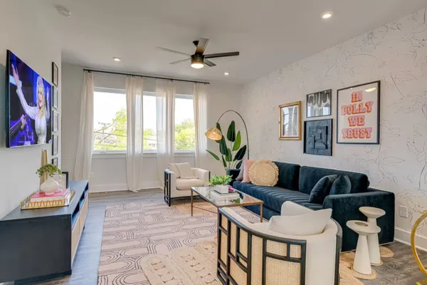 a living room with furniture and a window