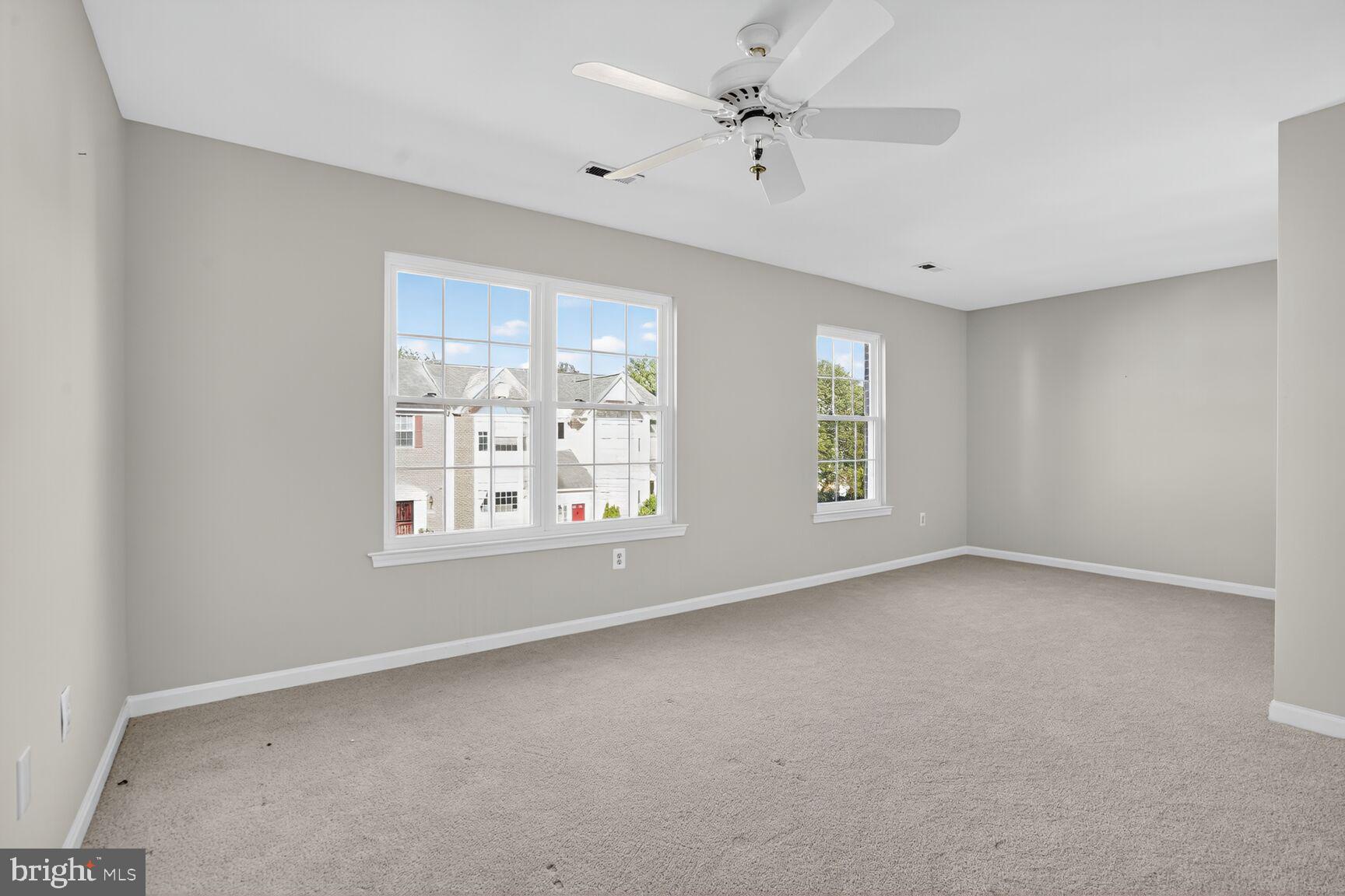 6836 Kerrywood Circle Centreville, VA 20121 - Photo 11 of 22 an empty room with windows and fan