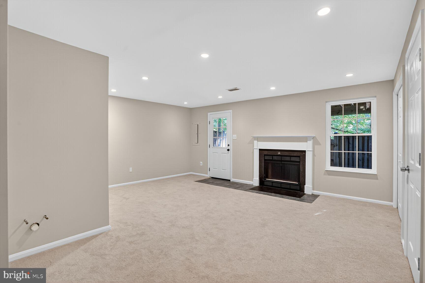 6836 Kerrywood Circle Centreville, VA 20121 - Photo 18 of 22 an empty room with windows and fireplace