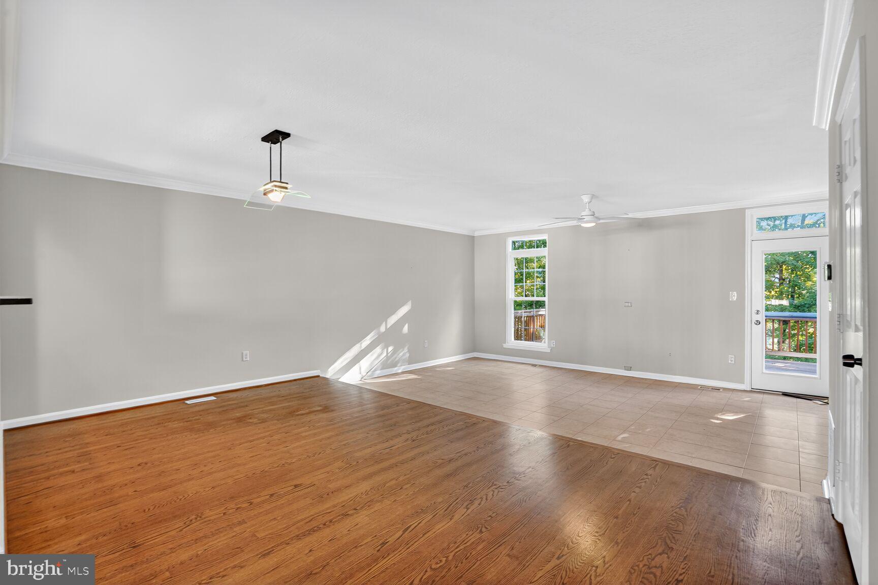 6836 Kerrywood Circle Centreville, VA 20121 - Photo 8 of 22 an empty room with wooden floor and windows