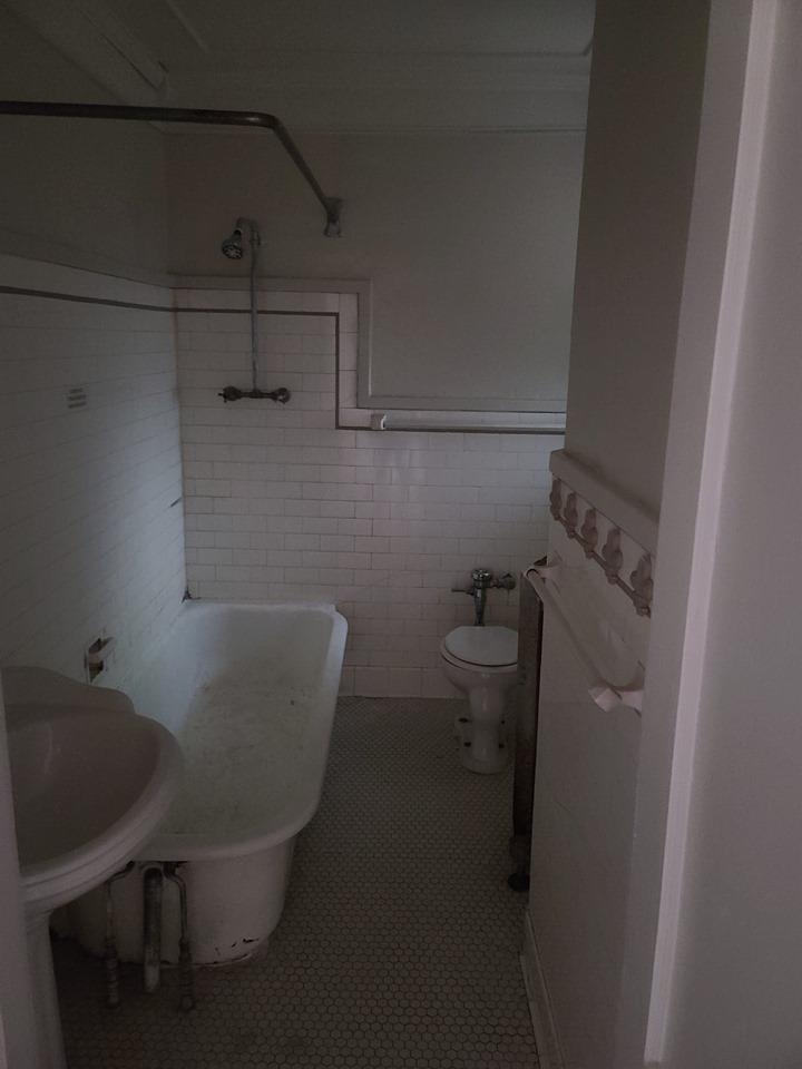 244 South Cleveland Street Memphis, TN 38104 - Photo 7 of 8 a bathroom with a sink and toilet