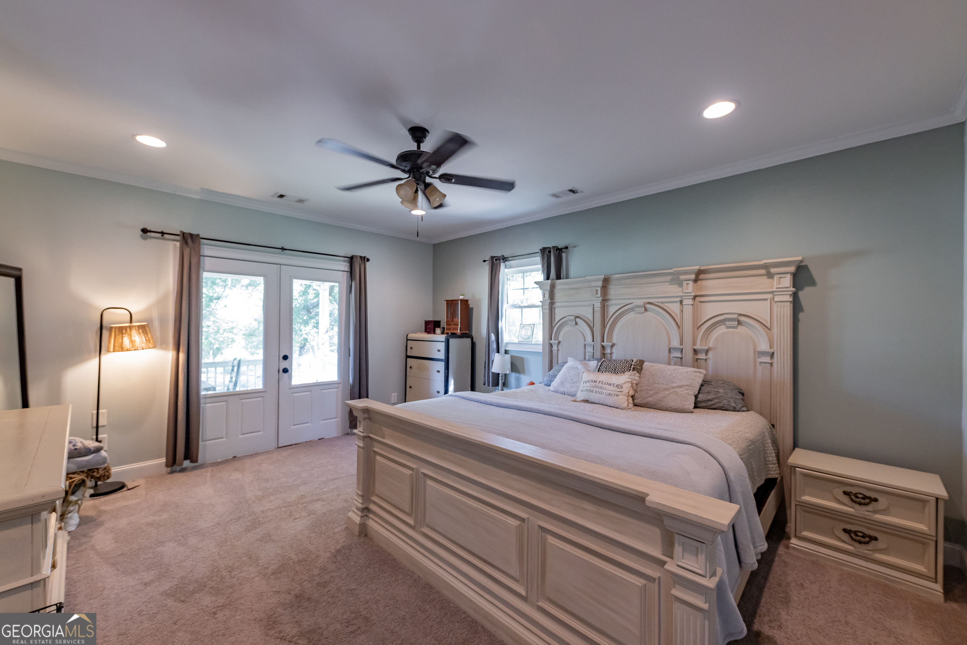 1730 Roland Road Thomaston, GA 30286 - Photo 12 of 55 a bedroom with a large bed and a chandelier