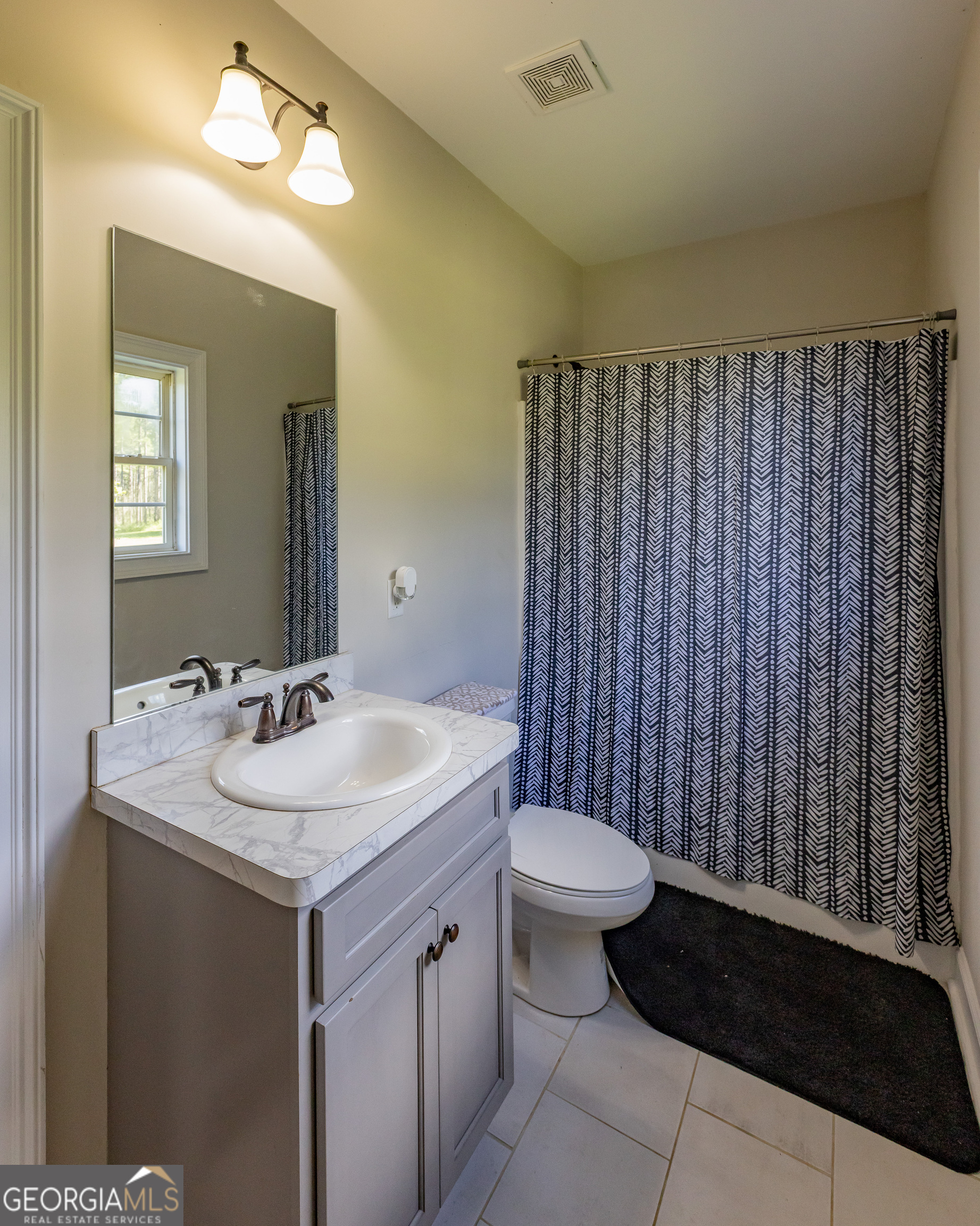 1730 Roland Road Thomaston, GA 30286 - Photo 20 of 55 a bathroom with a sink toilet and mirror
