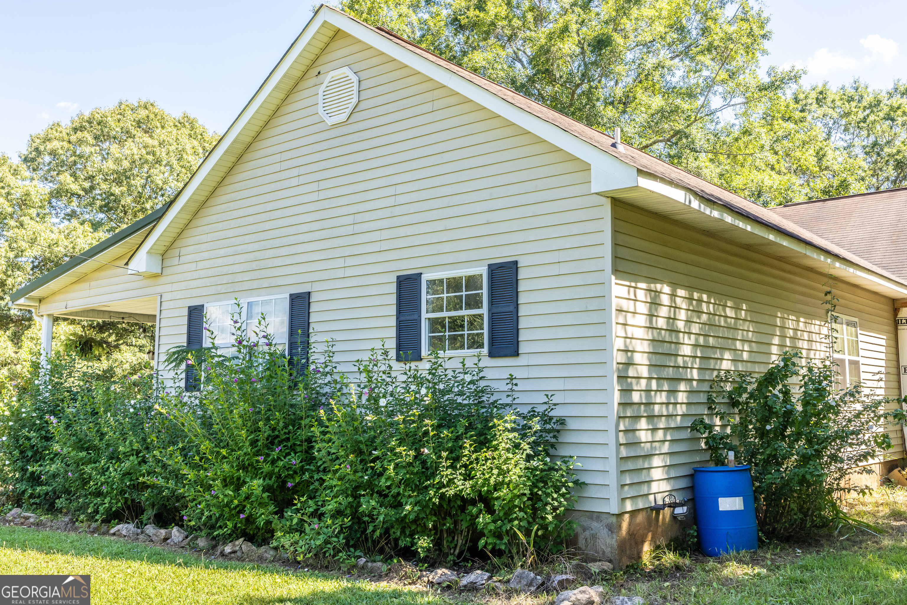 1730 Roland Road Thomaston, GA 30286 - Photo 29 of 55 a view of a house with brick walls and potted plants