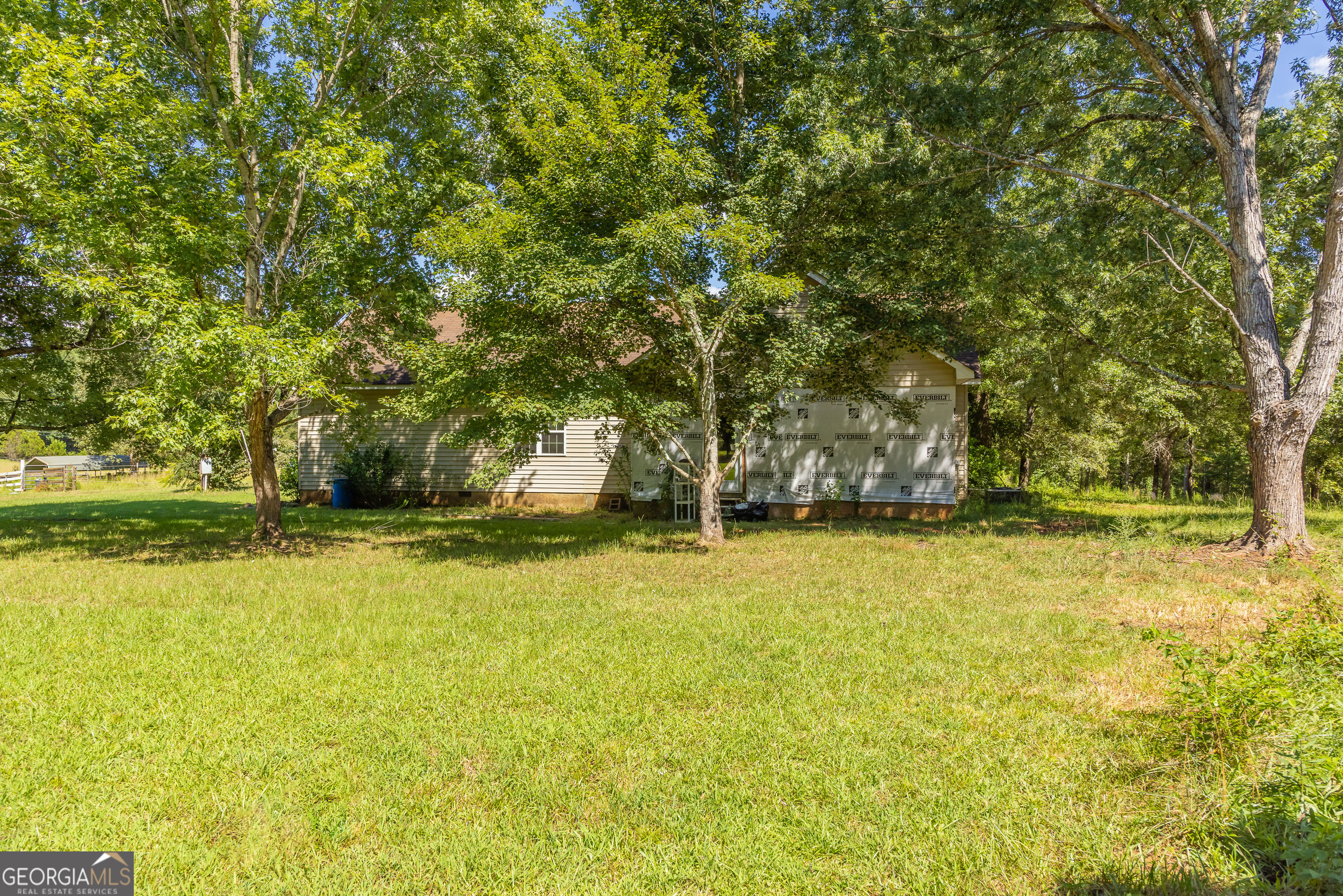 1730 Roland Road Thomaston, GA 30286 - Photo 30 of 55 a view of a swimming pool with an outdoor space and seating area
