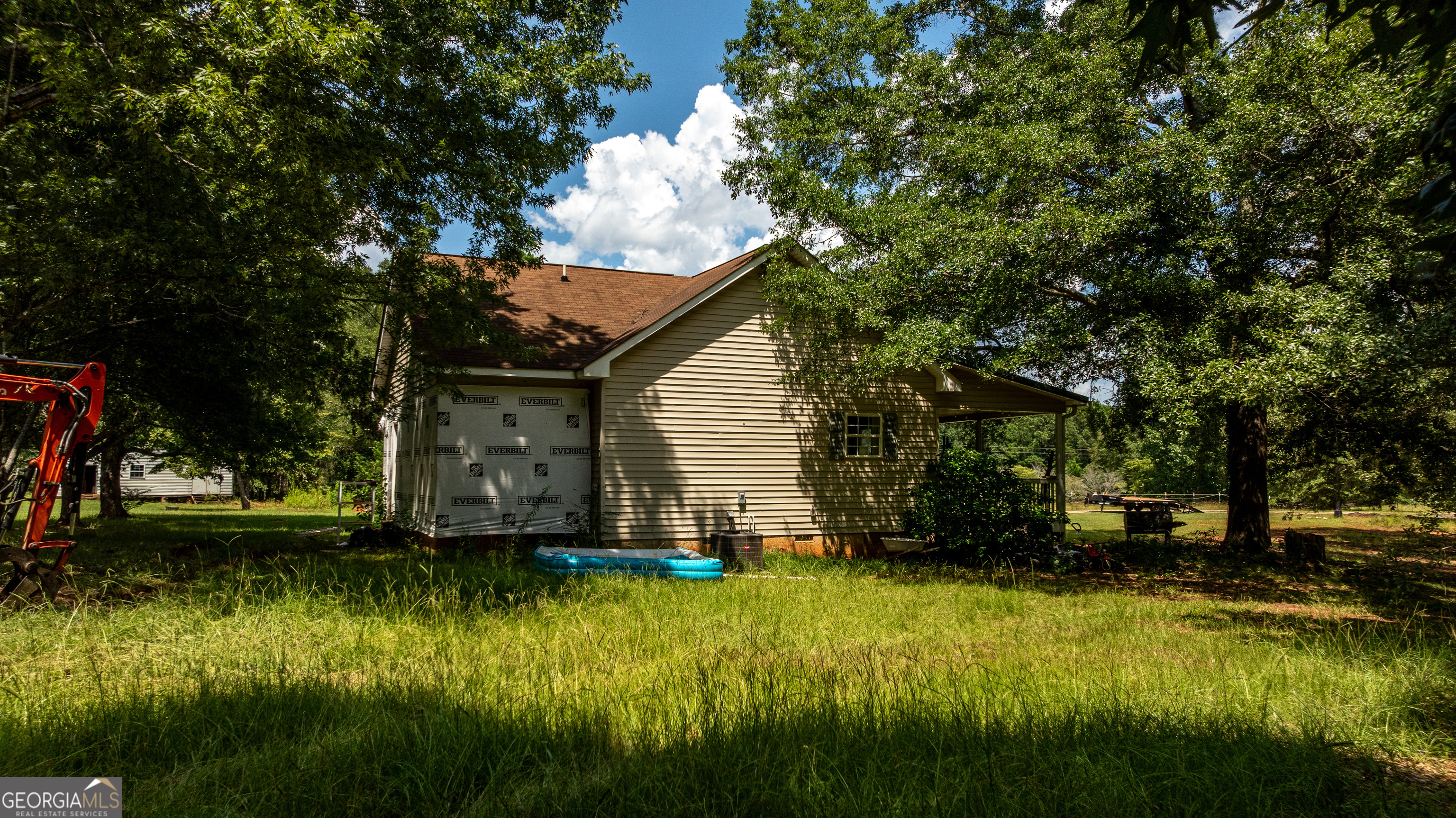 1730 Roland Road Thomaston, GA 30286 - Photo 36 of 55 a view of a backyard with plants and large trees