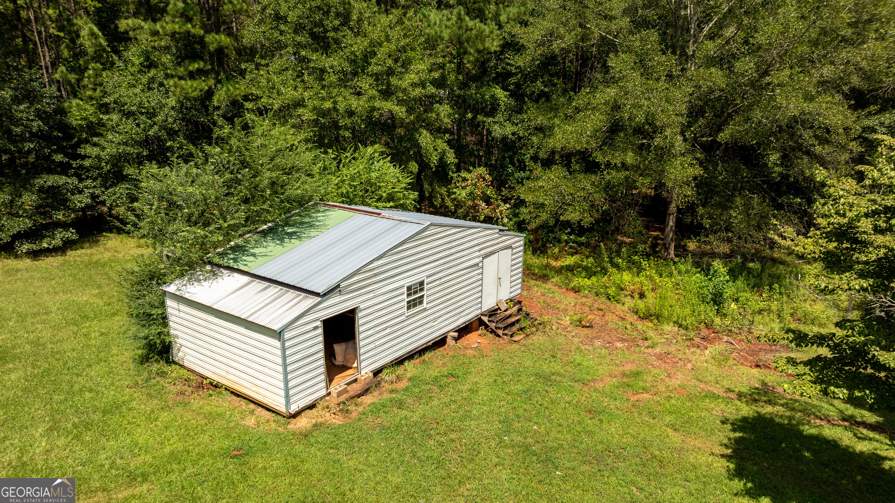 1730 Roland Road Thomaston, GA 30286 - Photo 41 of 55 a view of a backyard with tv