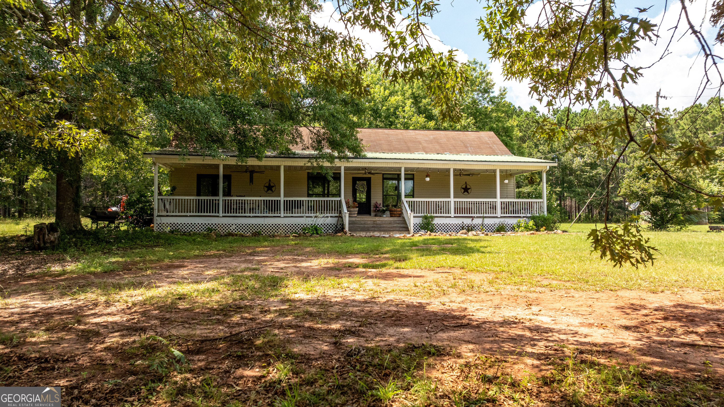 1730 Roland Road Thomaston, GA 30286 - Photo 53 of 55 a view of a house with a large window and a tree
