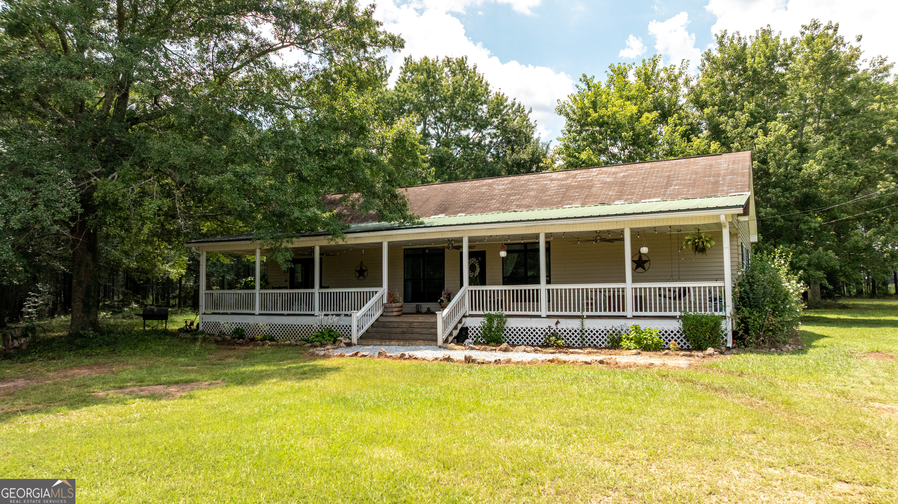 1730 Roland Road Thomaston, GA 30286 - Photo 54 of 55 a view of house with swimming pool next to a yard