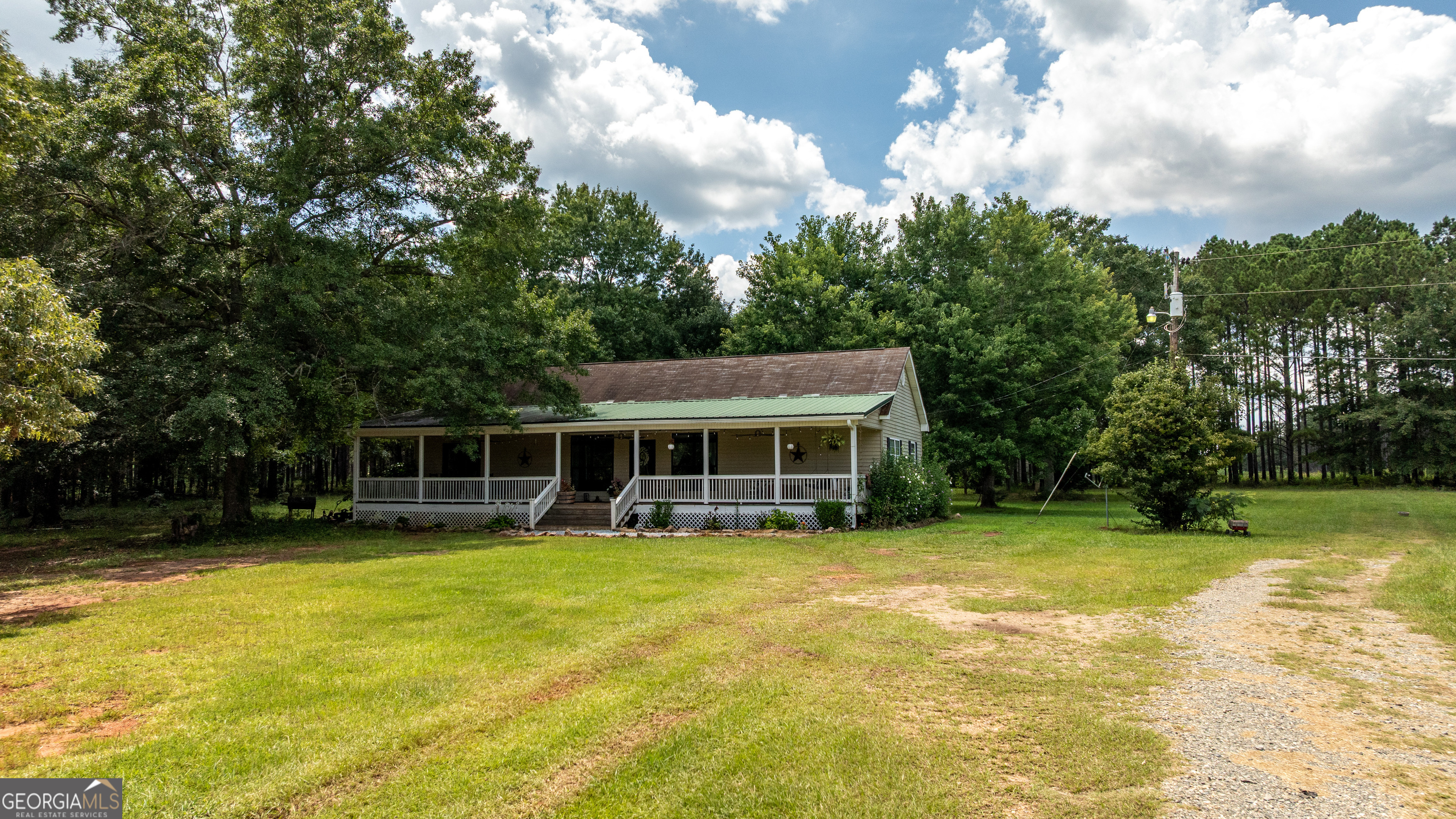 1730 Roland Road Thomaston, GA 30286 - Photo 55 of 55 a view of a house with garden and trees