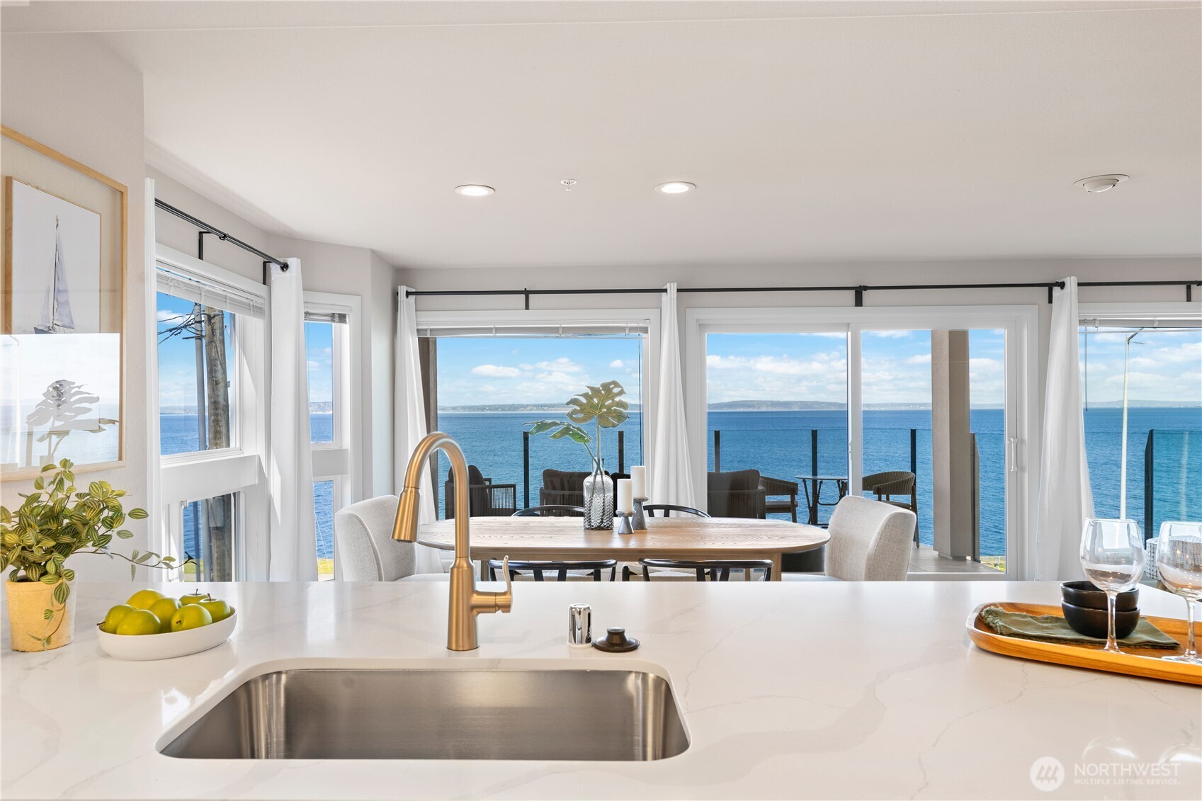 a large kitchen with a large window and counter space