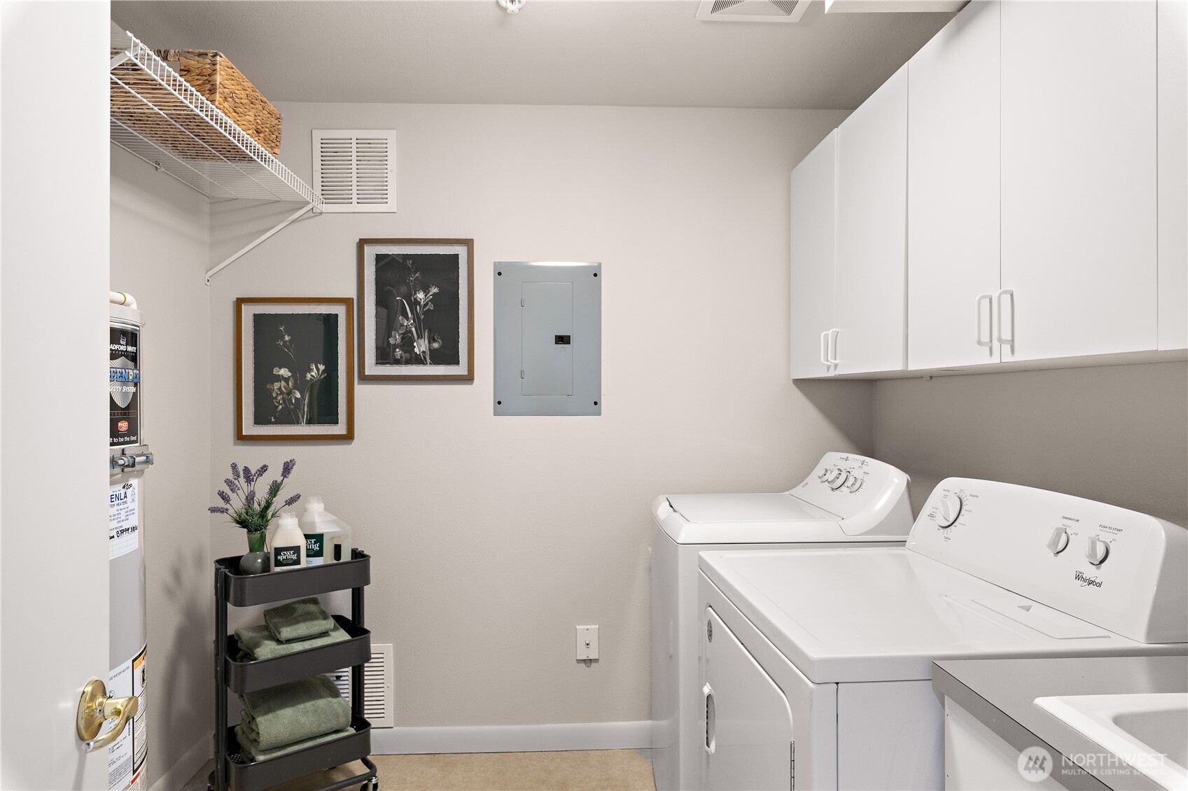 1300 Alki Avenue Southwest, Unit 200 Seattle, WA 98116 - Photo 15 of 32 a view of storage and utility room with washer and dryer