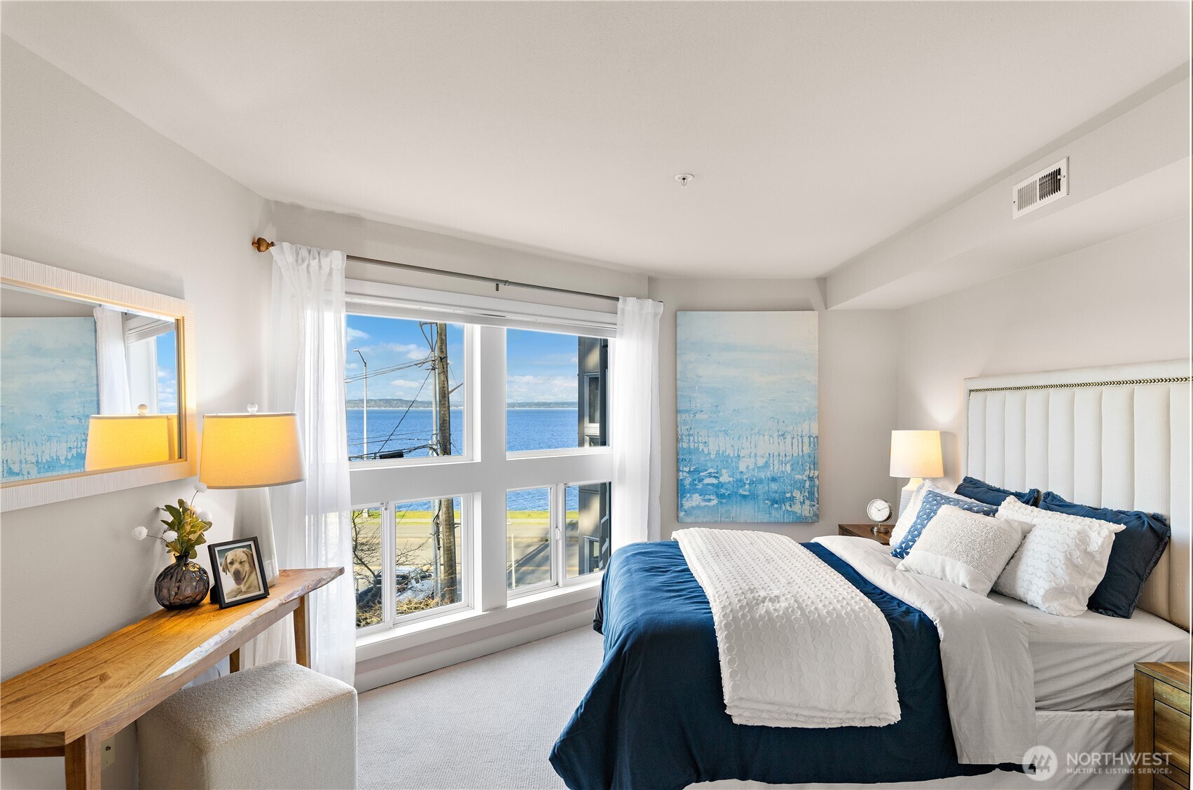 1300 Alki Avenue Southwest, Unit 200 Seattle, WA 98116 - Photo 18 of 32 a bedroom with a bed and a lamp with window