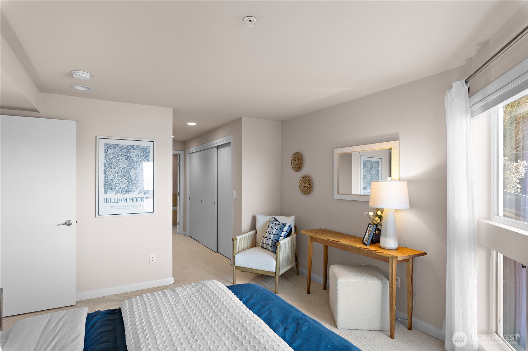 1300 Alki Avenue Southwest, Unit 200 Seattle, WA 98116 - Photo 19 of 32 a bedroom with a bed and wooden floor