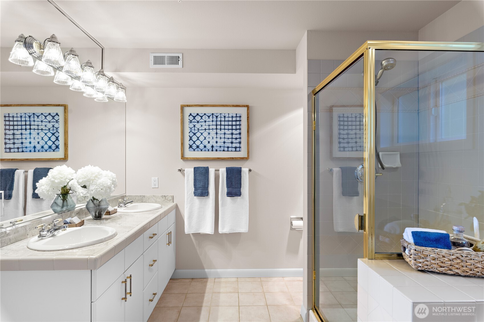 1300 Alki Avenue Southwest, Unit 200 Seattle, WA 98116 - Photo 22 of 32 a bathroom with a sink a mirror and a shower