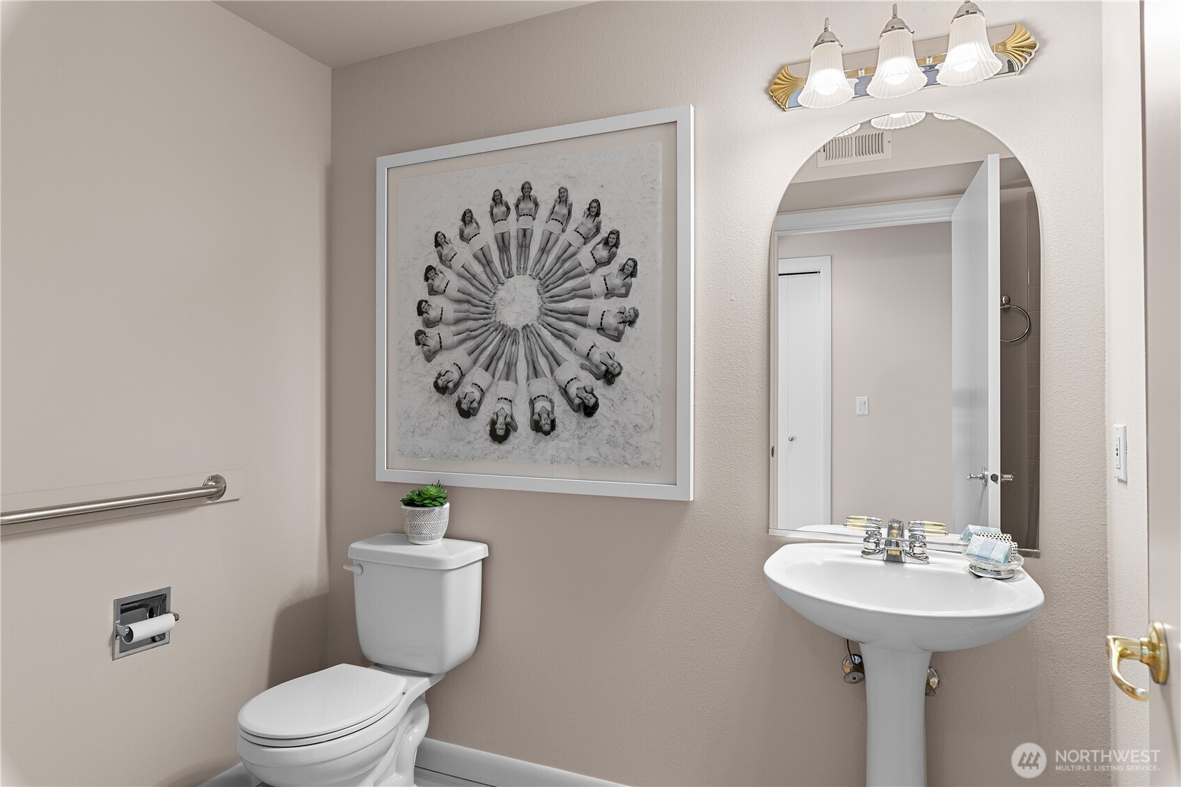 1300 Alki Avenue Southwest, Unit 200 Seattle, WA 98116 - Photo 24 of 32 a bathroom with a toilet sink and mirror