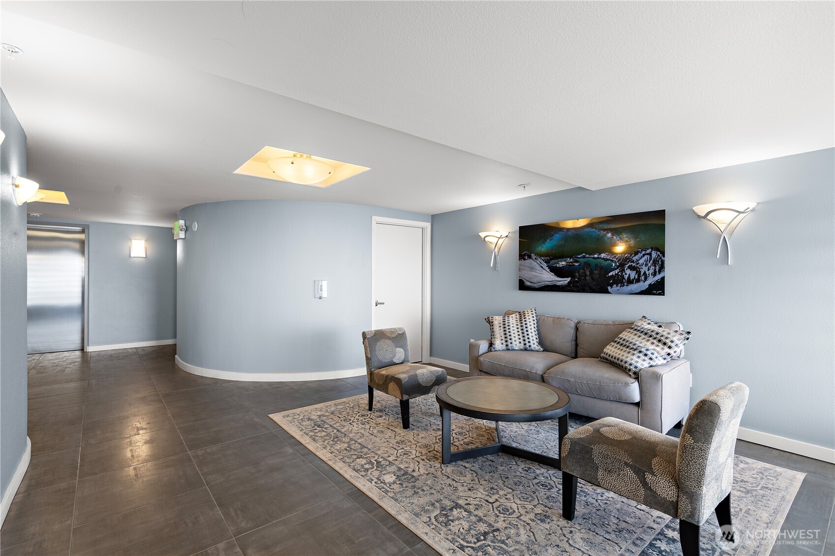 1300 Alki Avenue Southwest, Unit 200 Seattle, WA 98116 - Photo 27 of 32 a living room with furniture and a flat screen tv