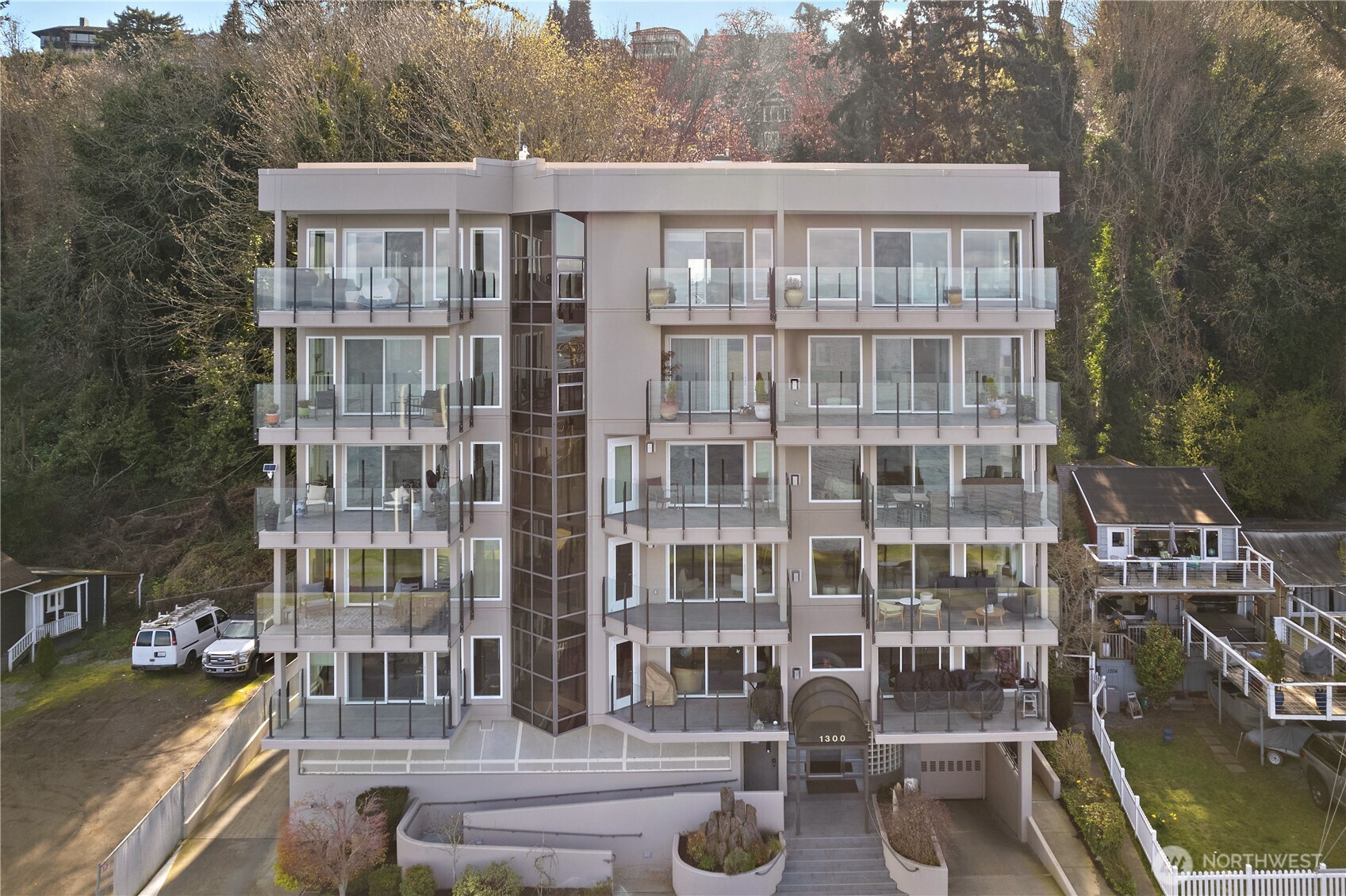 1300 Alki Avenue Southwest, Unit 200 Seattle, WA 98116 - Photo 32 of 32 a front view of a building with glass windows and brick walls