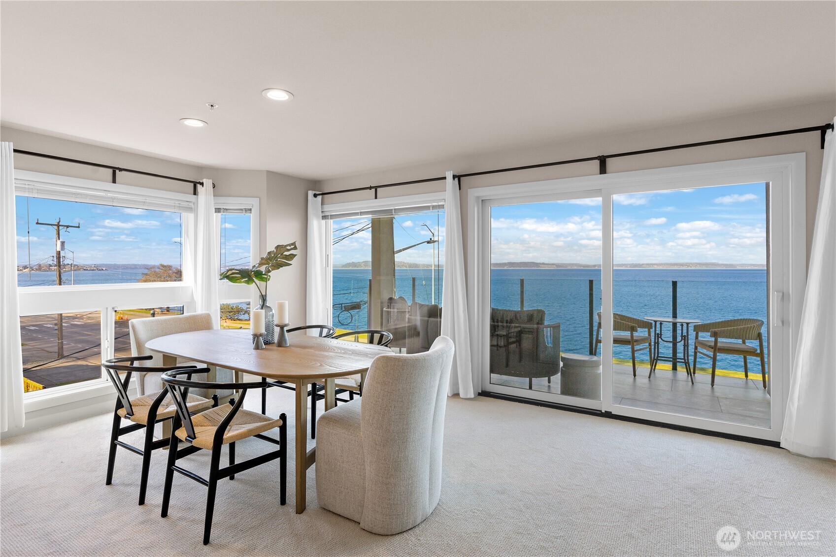 1300 Alki Avenue Southwest, Unit 200 Seattle, WA 98116 - Photo 4 of 32 a view of a dining room with furniture window and outside view