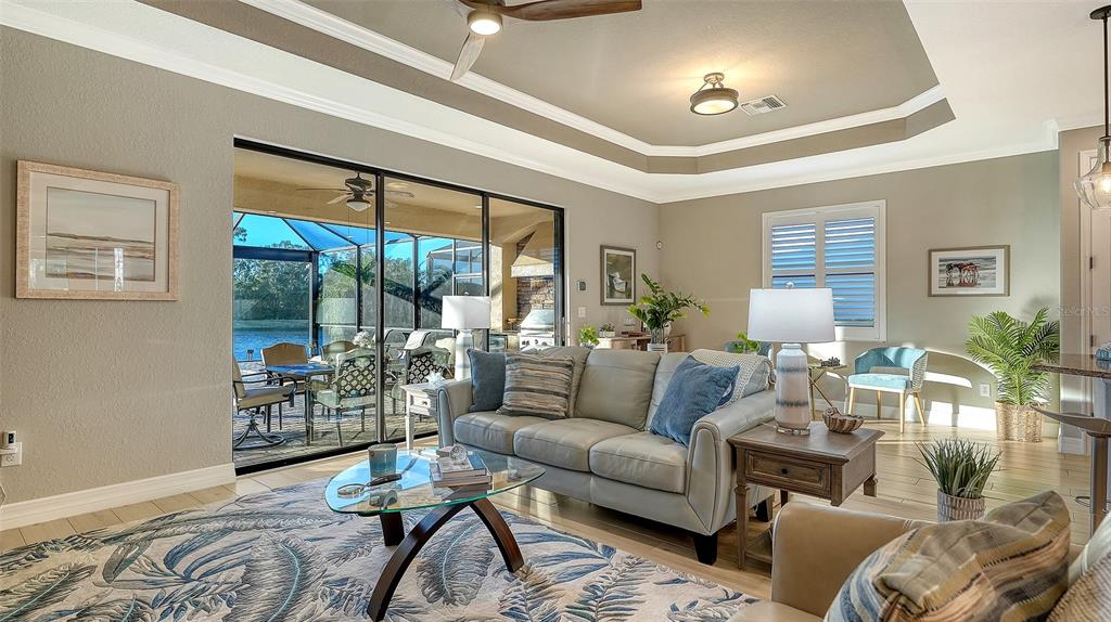 5914 Cessna Run Lakewood Ranch, FL 34211 - Photo 12 of 92 a living room with furniture and a large window