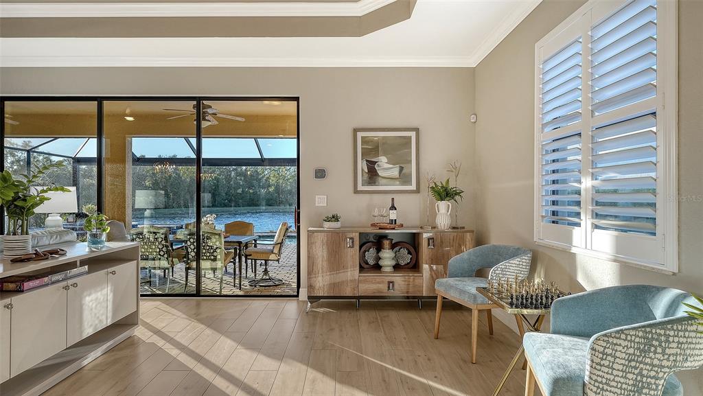 5914 Cessna Run Lakewood Ranch, FL 34211 - Photo 14 of 92 a living room with furniture and a large window