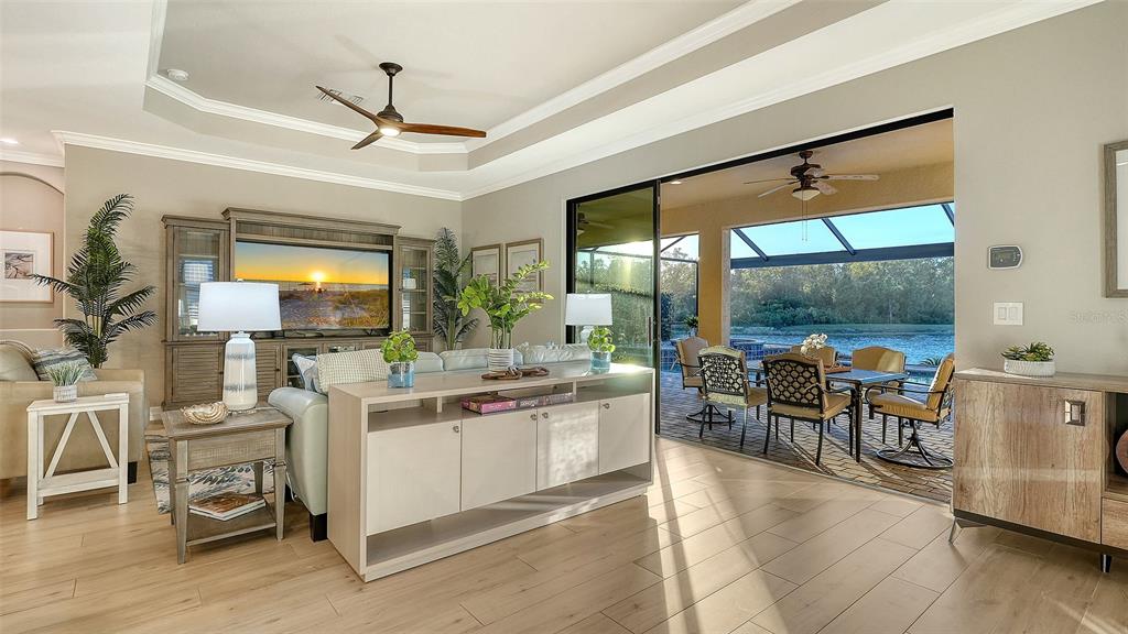 5914 Cessna Run Lakewood Ranch, FL 34211 - Photo 15 of 92 a view of a dining room with furniture window and outside view