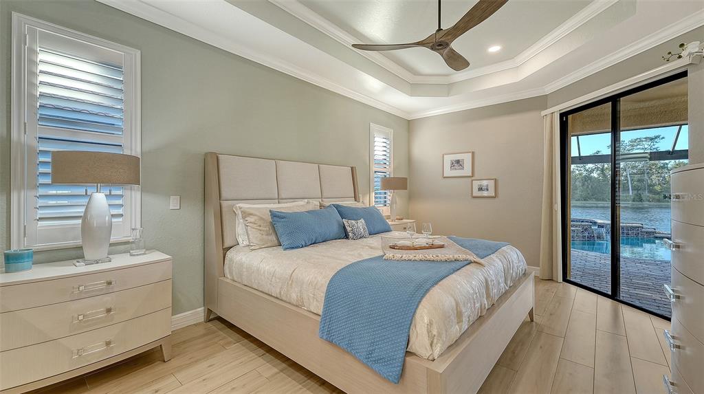 5914 Cessna Run Lakewood Ranch, FL 34211 - Photo 25 of 92 a bedroom with a large bed and a window