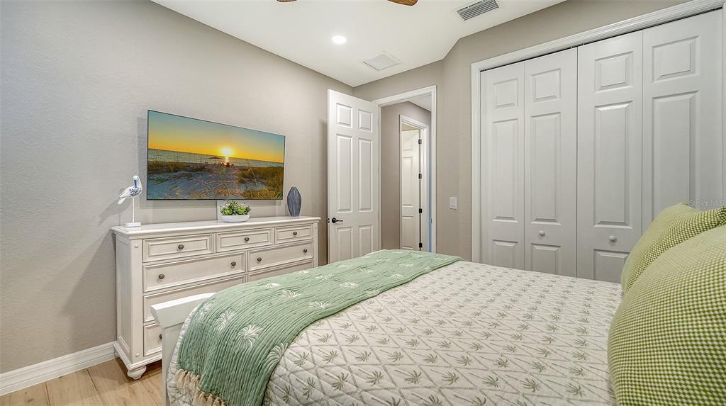 5914 Cessna Run Lakewood Ranch, FL 34211 - Photo 35 of 92 a bedroom with a bed and a flat screen tv