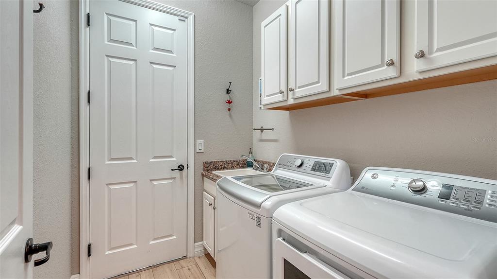 5914 Cessna Run Lakewood Ranch, FL 34211 - Photo 37 of 92 a utility room with dryer and washer