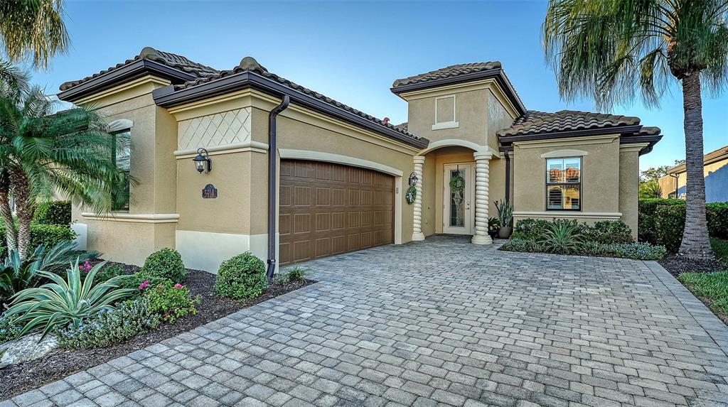 5914 Cessna Run Lakewood Ranch, FL 34211 - Photo 4 of 92 a front view of a house with garden