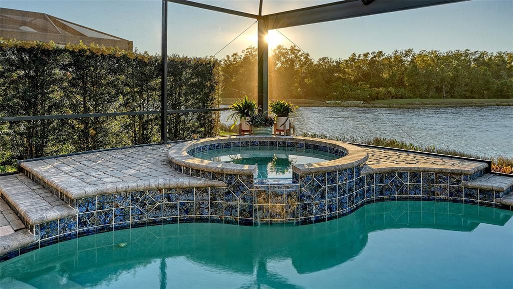 5914 Cessna Run Lakewood Ranch, FL 34211 - Photo 49 of 92 a view of a swimming pool with a garden