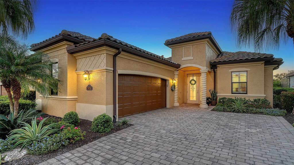 5914 Cessna Run Lakewood Ranch, FL 34211 - Photo 5 of 92 a front view of a house with a yard