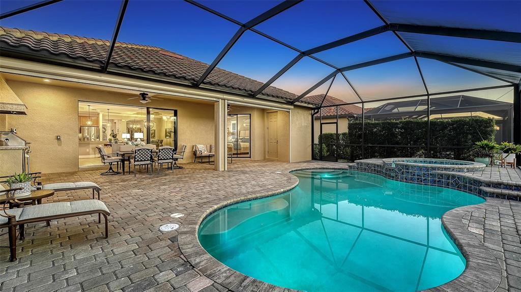 5914 Cessna Run Lakewood Ranch, FL 34211 - Photo 51 of 92 a view of a swimming pool with a patio
