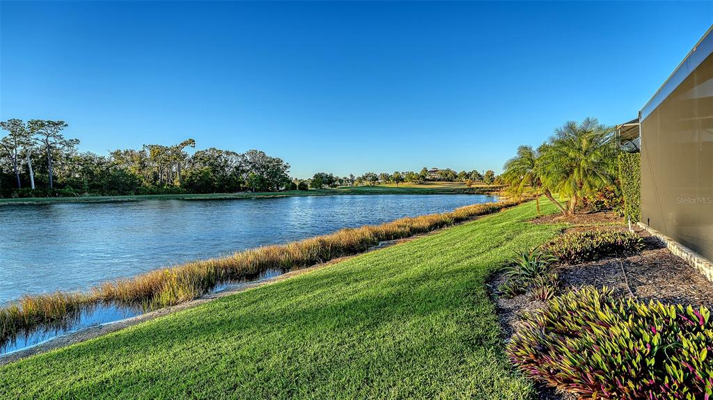 5914 Cessna Run Lakewood Ranch, FL 34211 - Photo 55 of 92 a view of a lake with houses in the back