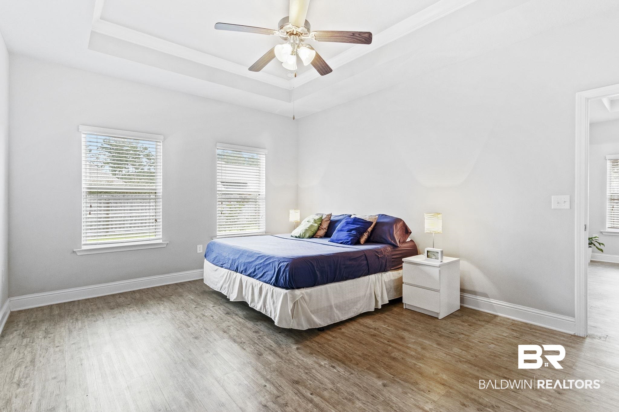 31643 Kestrel Loop Daphne, AL 36527 - Photo 19 of 59 Bedroom featuring hardwood / wood-style floors, ceiling fan, and a raised ceiling