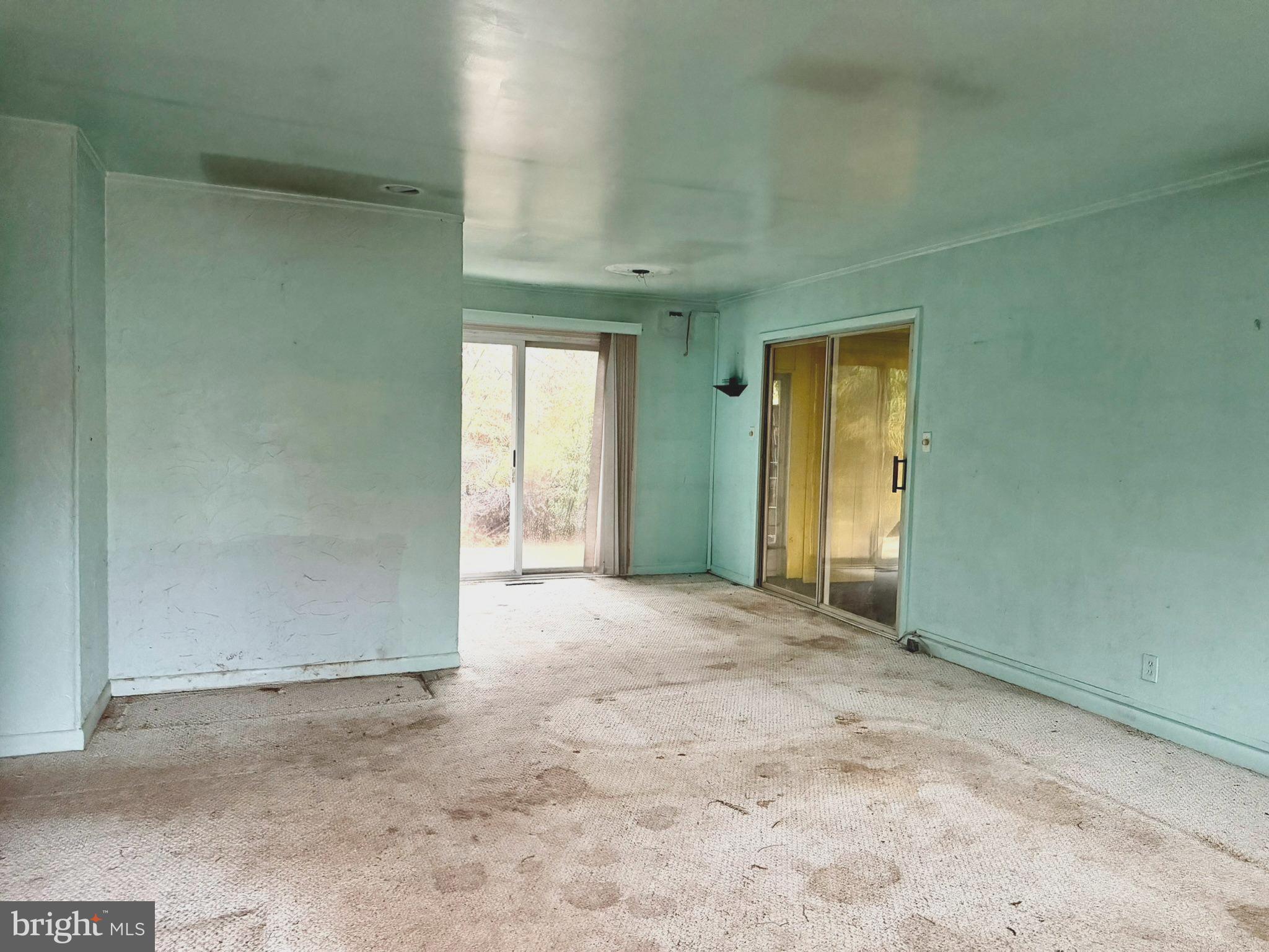 112 Strawberry Way Rehoboth Beach, DE 19971 - Photo 2 of 14 an empty room with a natural light