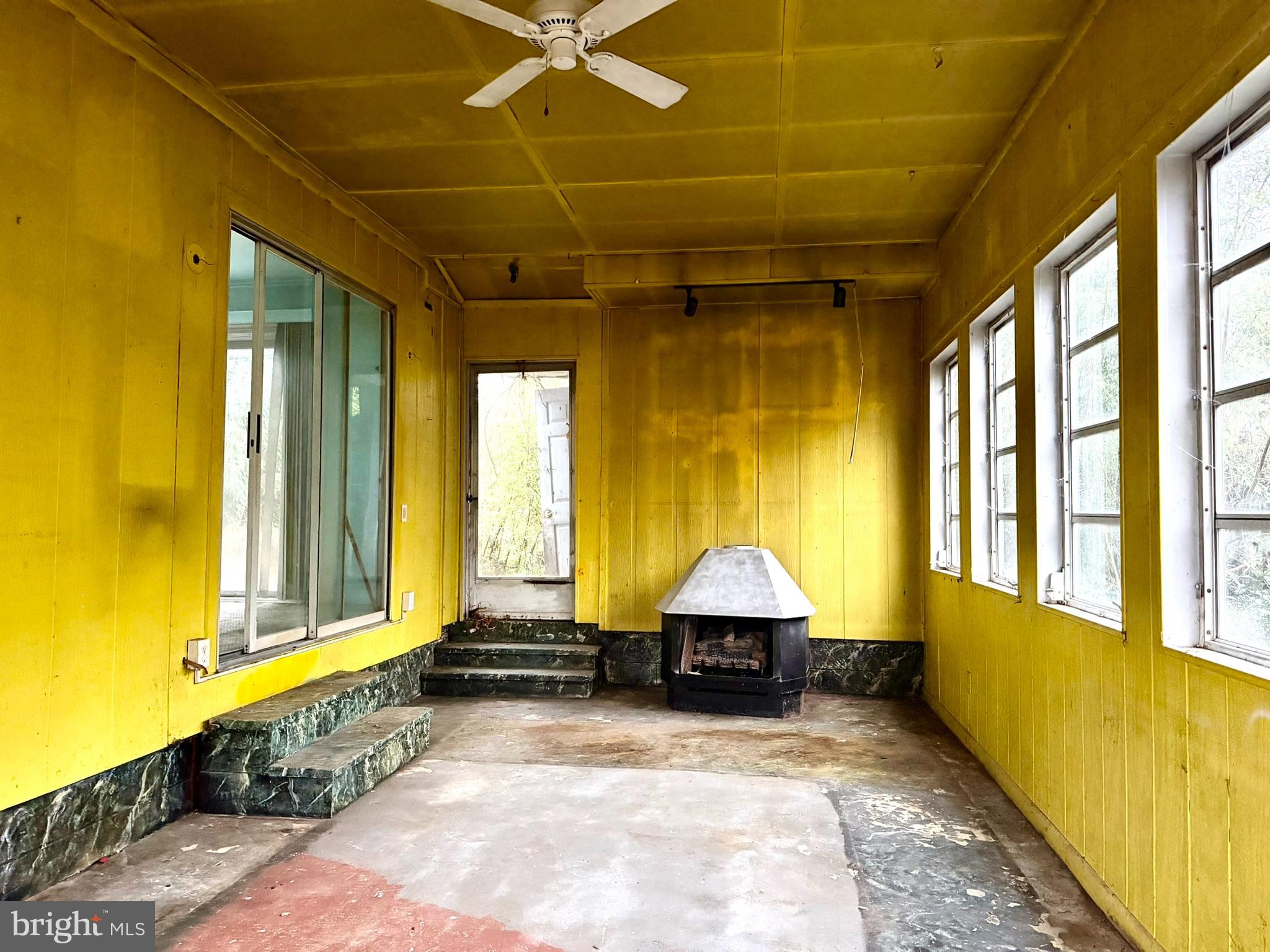 112 Strawberry Way Rehoboth Beach, DE 19971 - Photo 5 of 14 a view of a room with window and brick walls