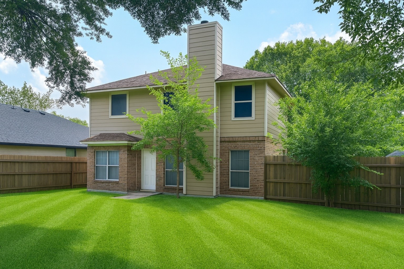 2911 Hummingbird Lane Humble, TX 77396 - Photo 3 of 6 a front view of a house with a garden