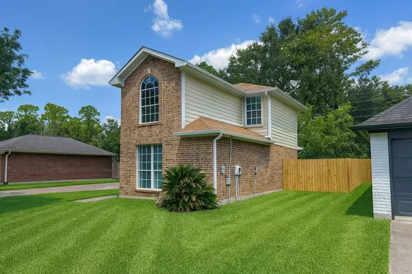 a front view of a house with a yard