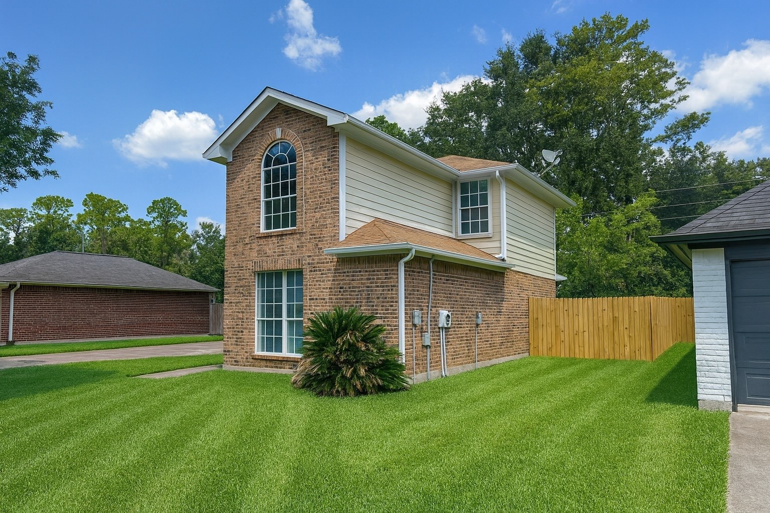 2911 Hummingbird Lane Humble, TX 77396 - Photo 4 of 6 a front view of a house with a yard