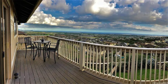 a view of a balcony with wooden floor