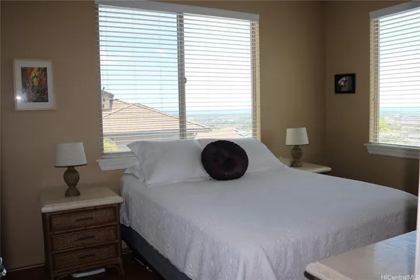 a bedroom with a bed and a table in it