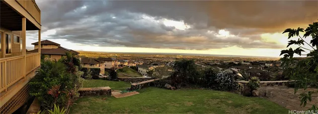 a view of a garden with lawn chairs