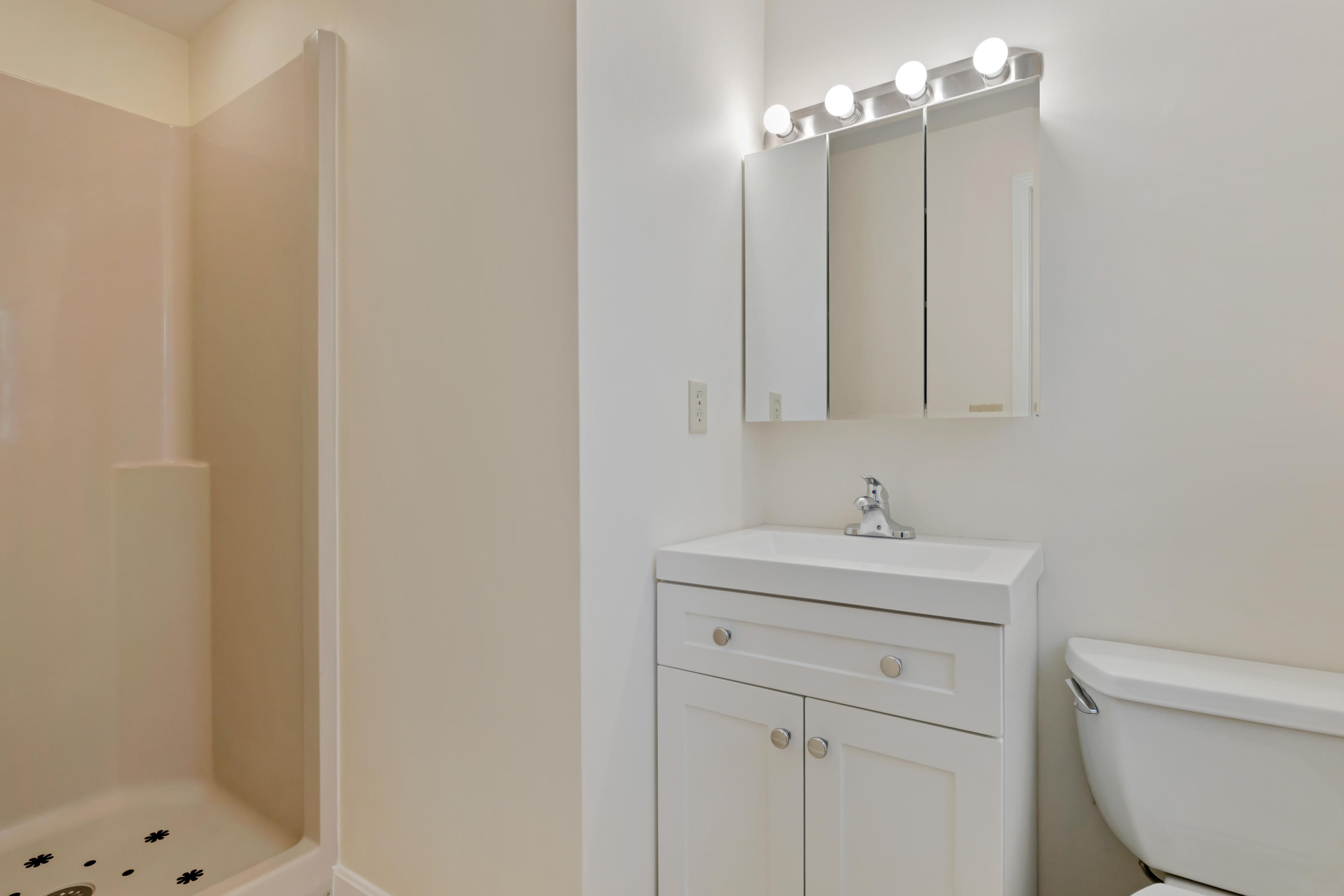 43 Valley Brook Road Centerville, MA 02632 - Photo 11 of 21 a bathroom with a sink a toilet and a shower