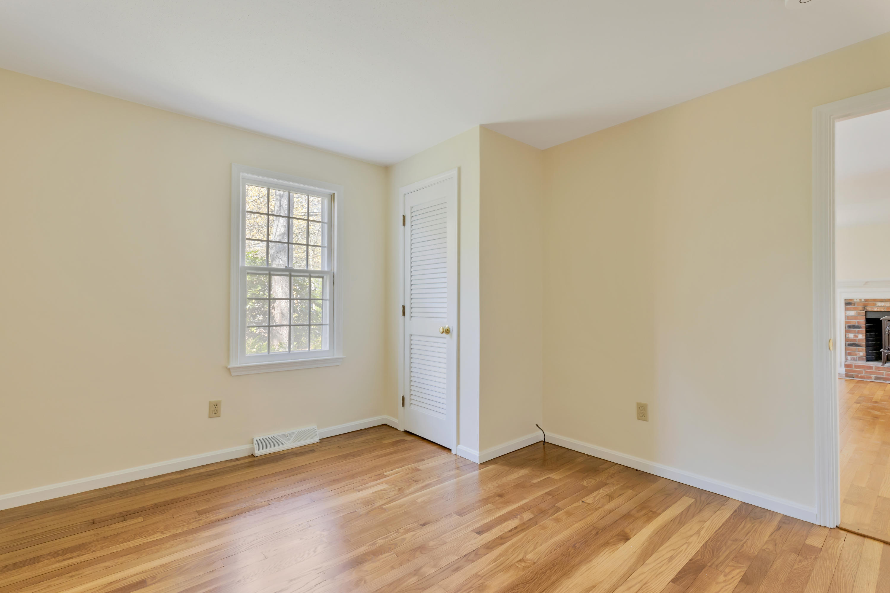 43 Valley Brook Road Centerville, MA 02632 - Photo 13 of 21 an empty room with wooden floor and windows