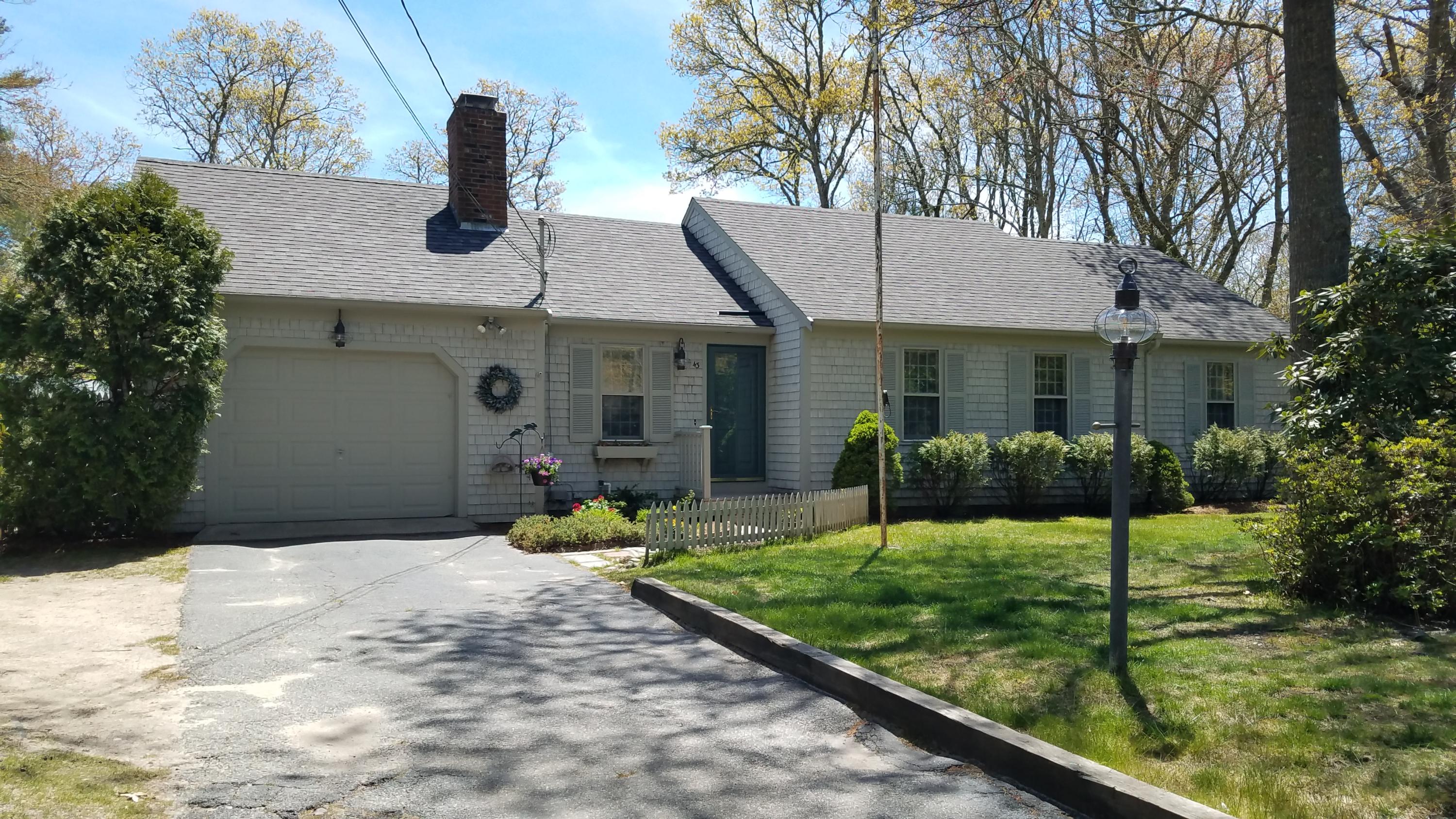43 Valley Brook Road Centerville, MA 02632 - Photo 2 of 21 a front view of a house with a yard